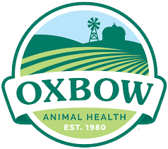 Oxbow Animal Health logo featuring a green field, palm tree, and barn with the text 'Oxbow Animal Health Est. 1980'