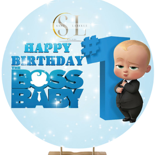A birthday sign with a cartoon baby in a suit, standing next to a large blue number one with a hashtag. The sign reads "Happy Birthday The Boss Baby."