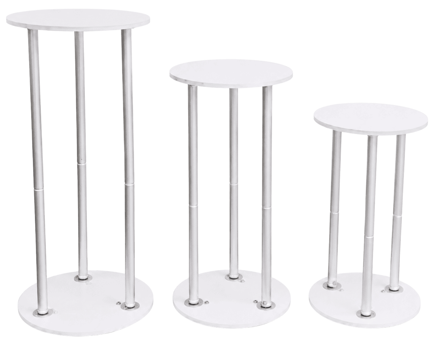 A set of four white, oval-shaped tables with four legs each, arranged in increasing height order from right to left.
