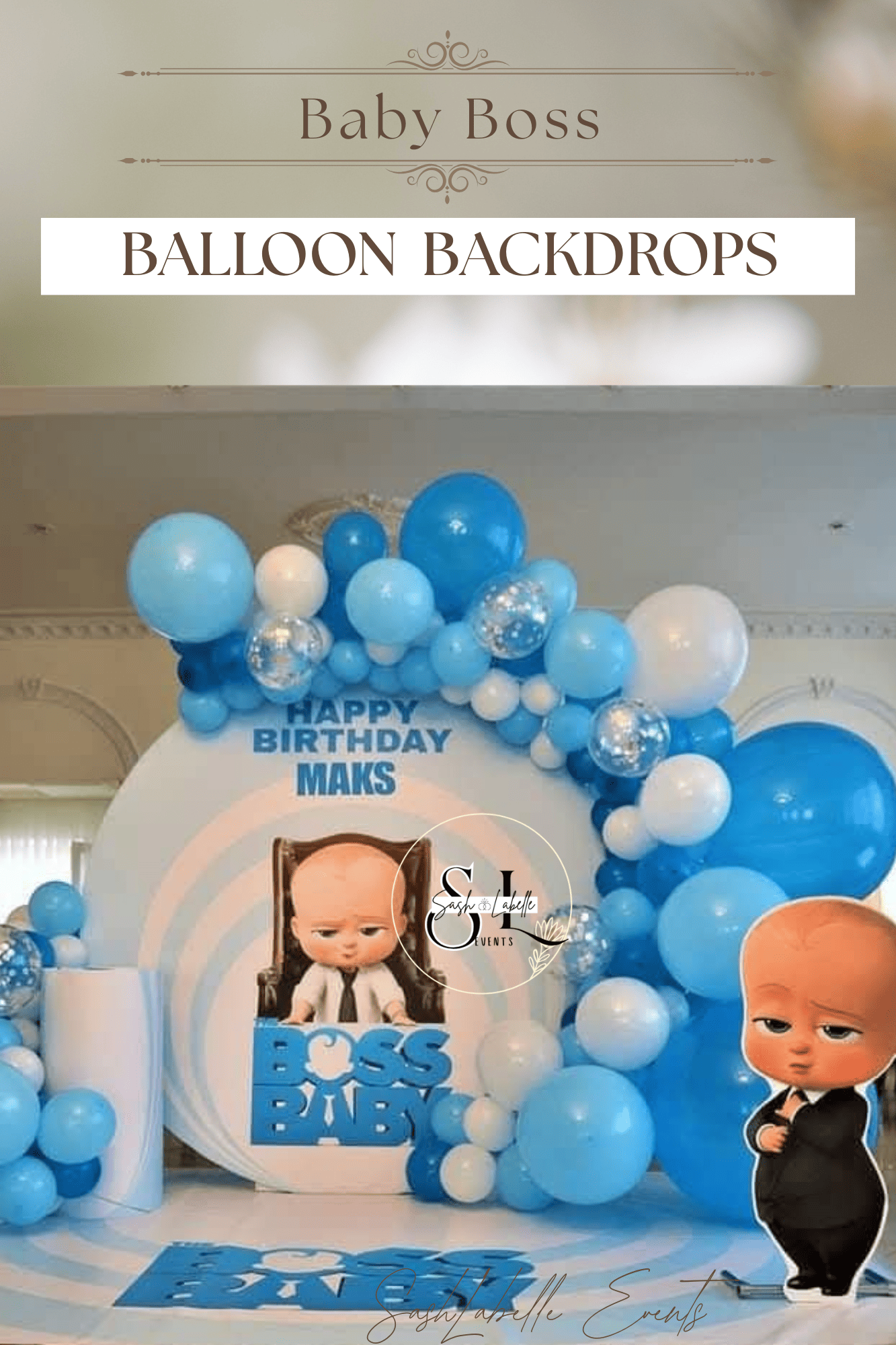 Baby Boss themed birthday decoration with blue and white balloons surrounding a backdrop featuring the character Baby Boss at a desk with the birthday message. The backdrop reads 'Baby Boss' and 'Balloon Backdrops.'