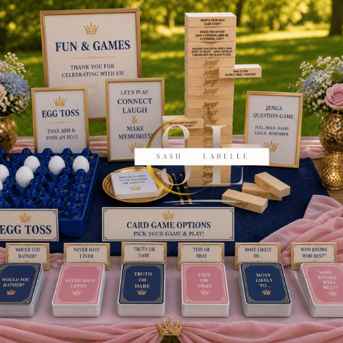 Table setup for a game area at a celebration with Jenga, card games, and signs with game instructions, decorated with flowers and a pink tablecloth.