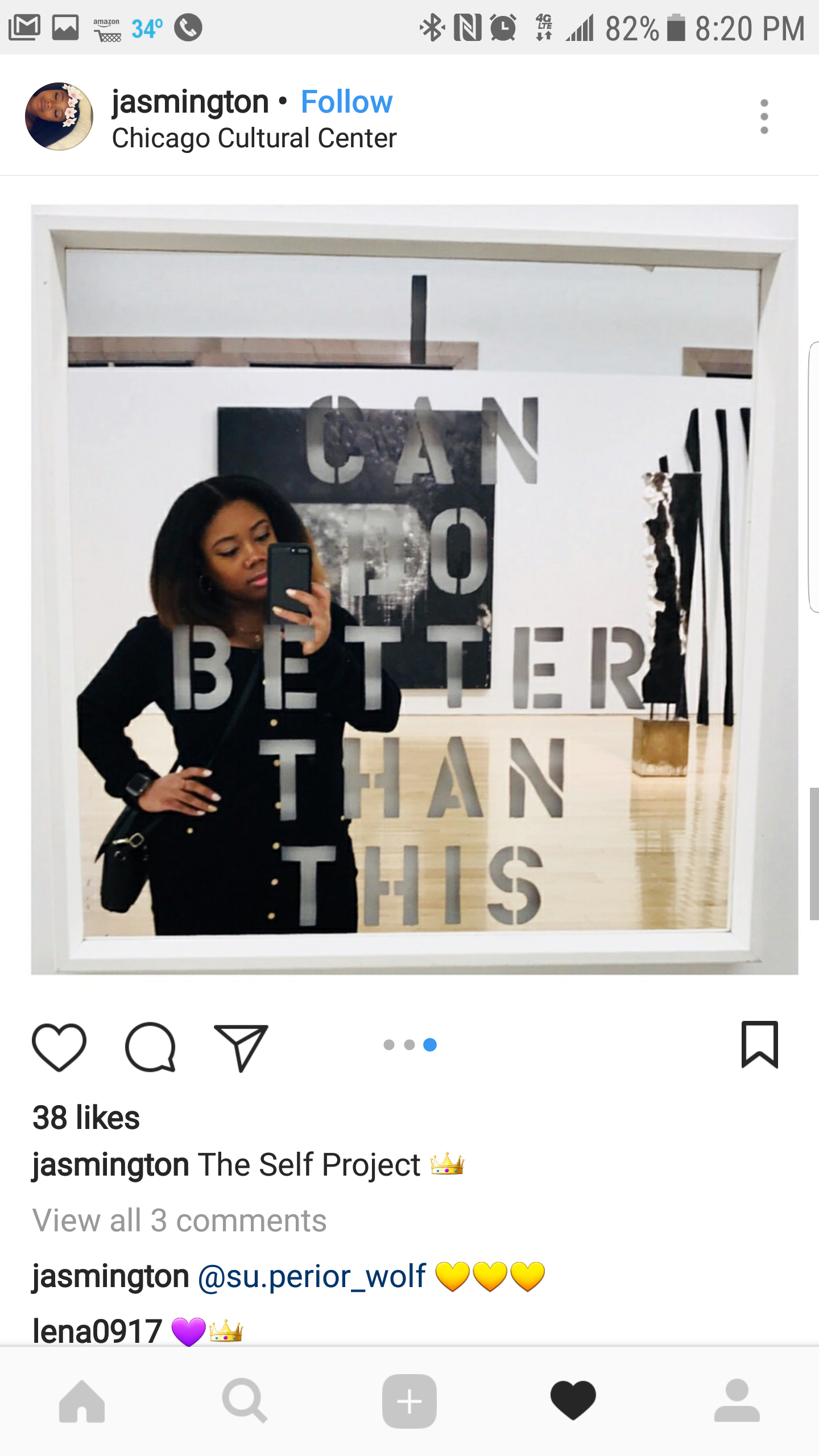 A woman taking a mirror selfie at Chicago Cultural Center, with a reflective mirror displaying the words 'CAN DO BETTER THAN THIS' in the reflection.