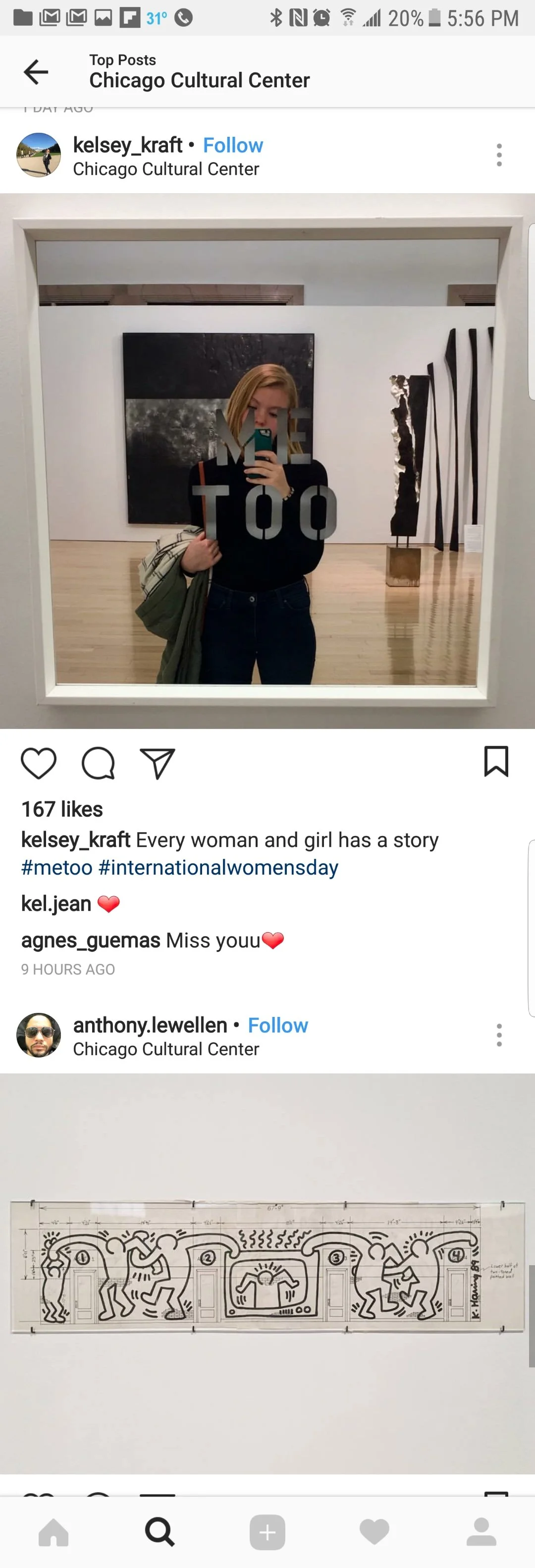 A woman with blonde hair taking a selfie in a mirror at the Chicago Cultural Center, holding a bag, with artwork and sculptures visible in the background.