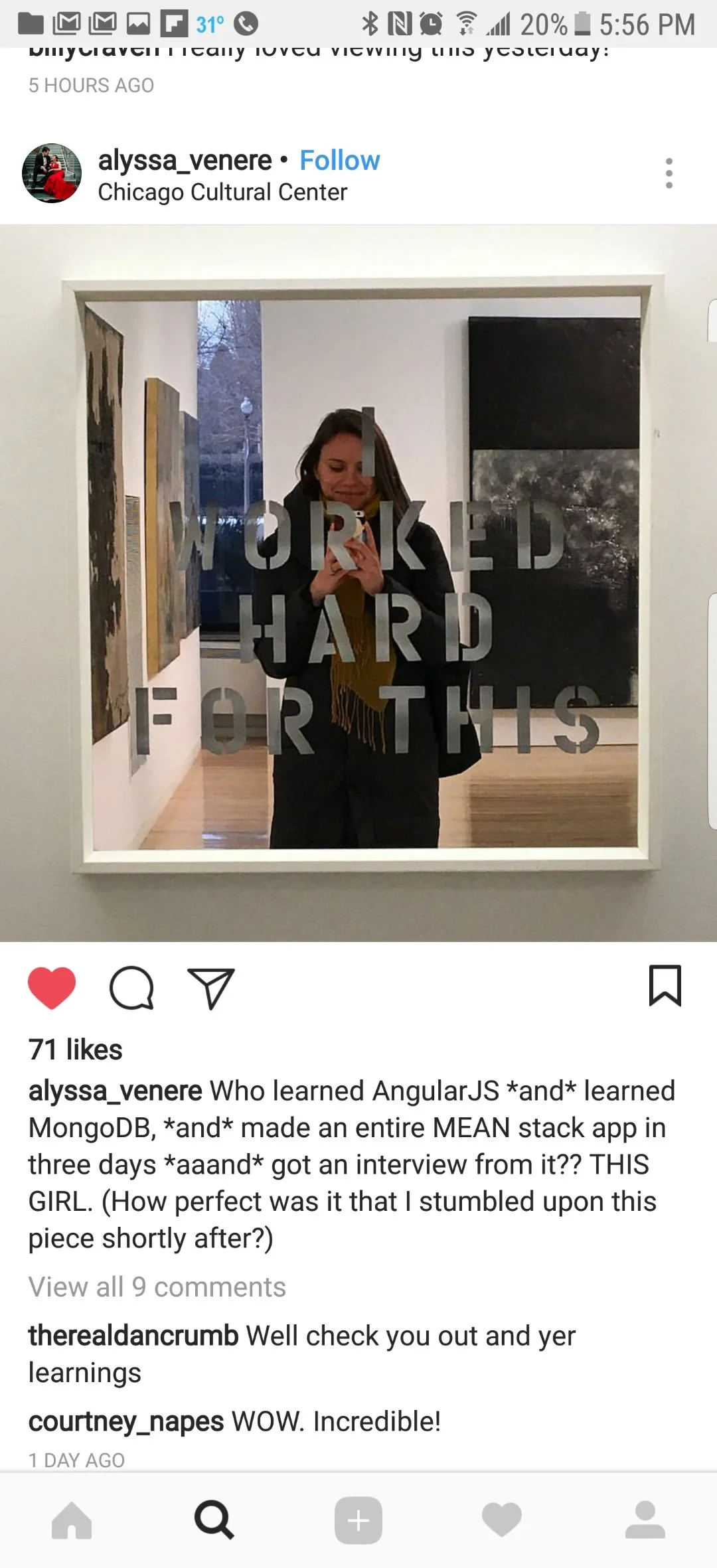 A woman taking a selfie in a mirror at the Chicago Cultural Center, with the words 'WORKED HARD FOR THIS' written on the mirror.