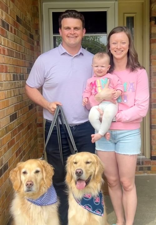 Rob Clark, his wife Sam, their daughter, and 2 dogs.y