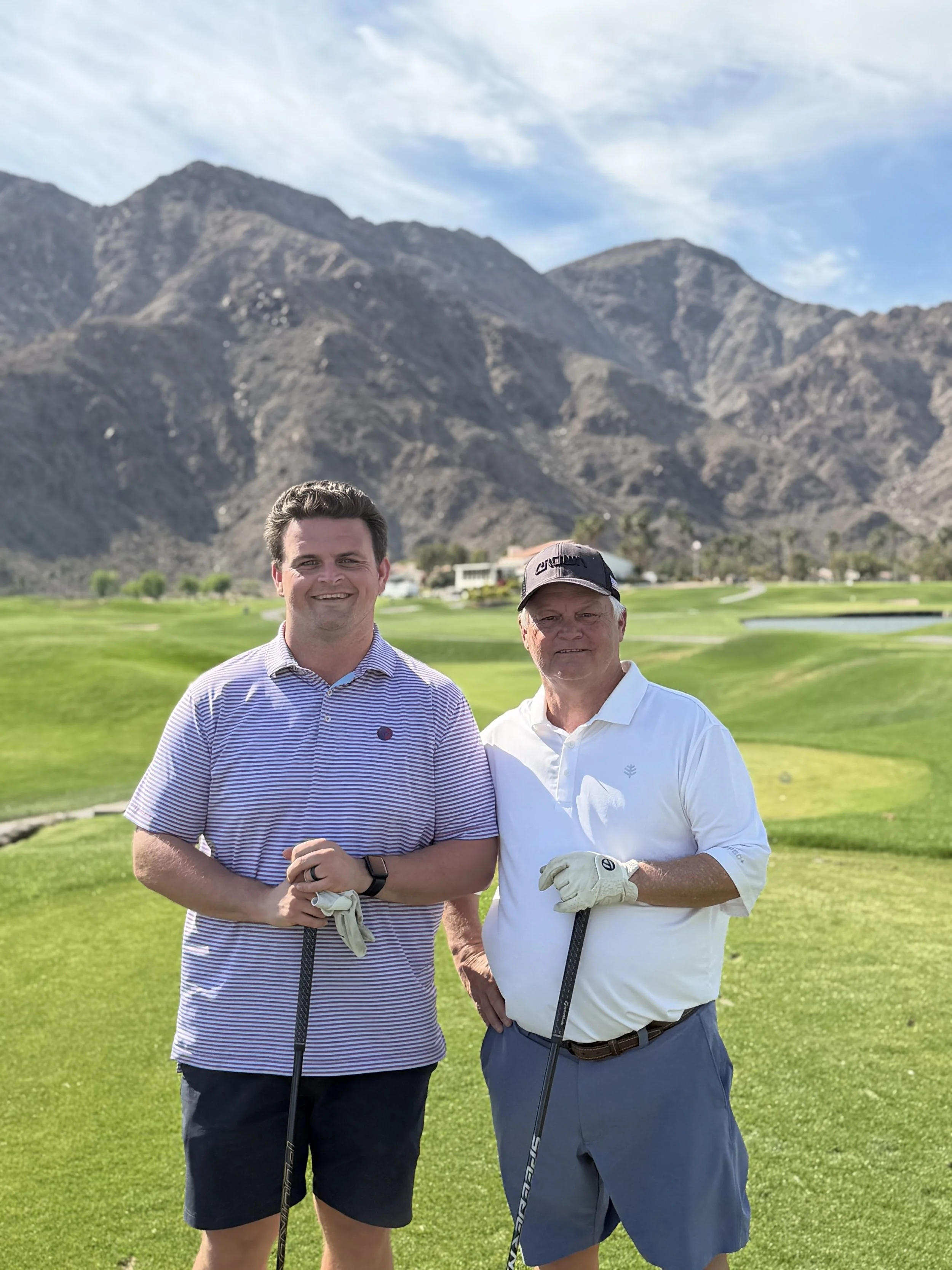 Rob Clark and his father playing a round of golf.