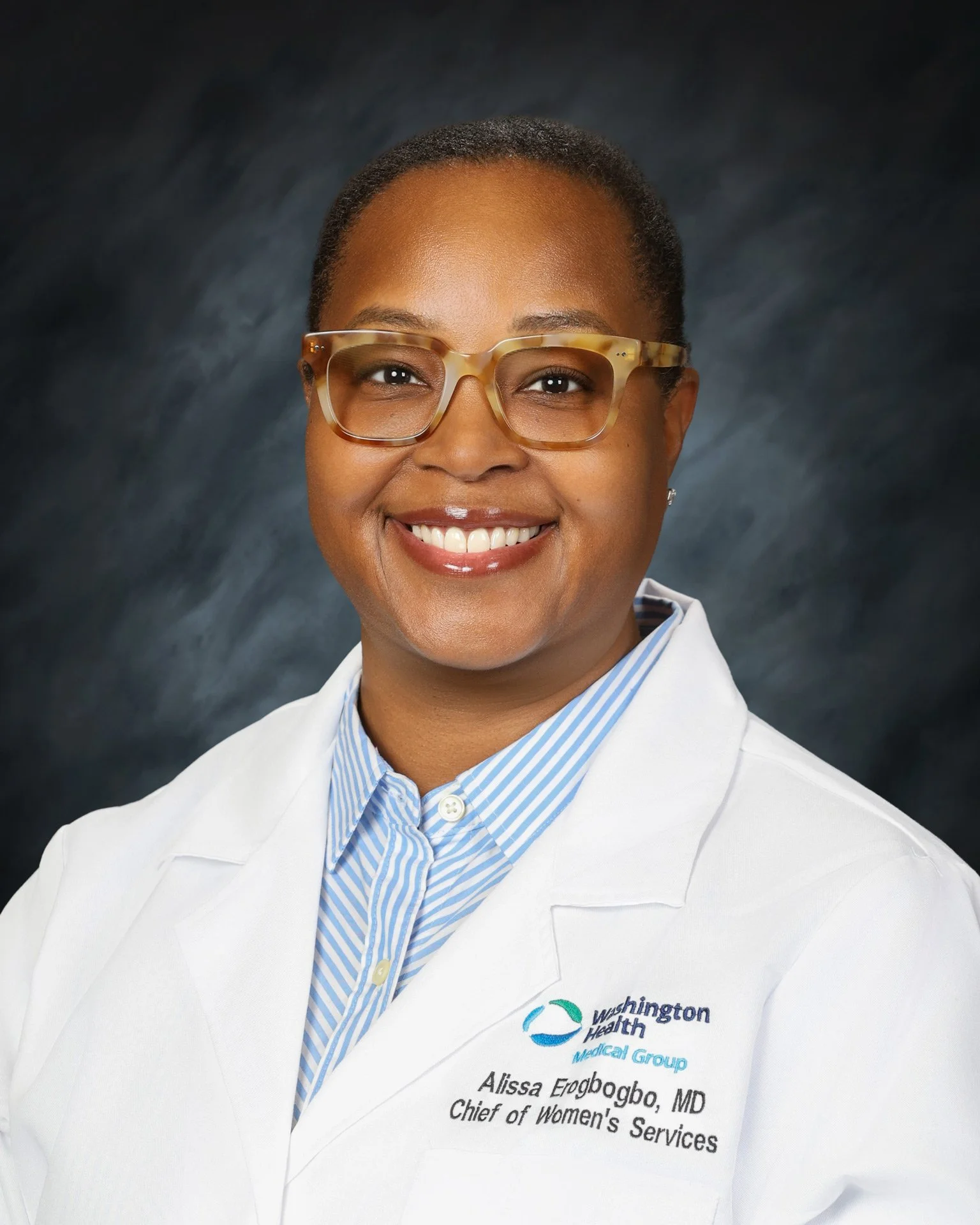 female doctor wearing a white coat.