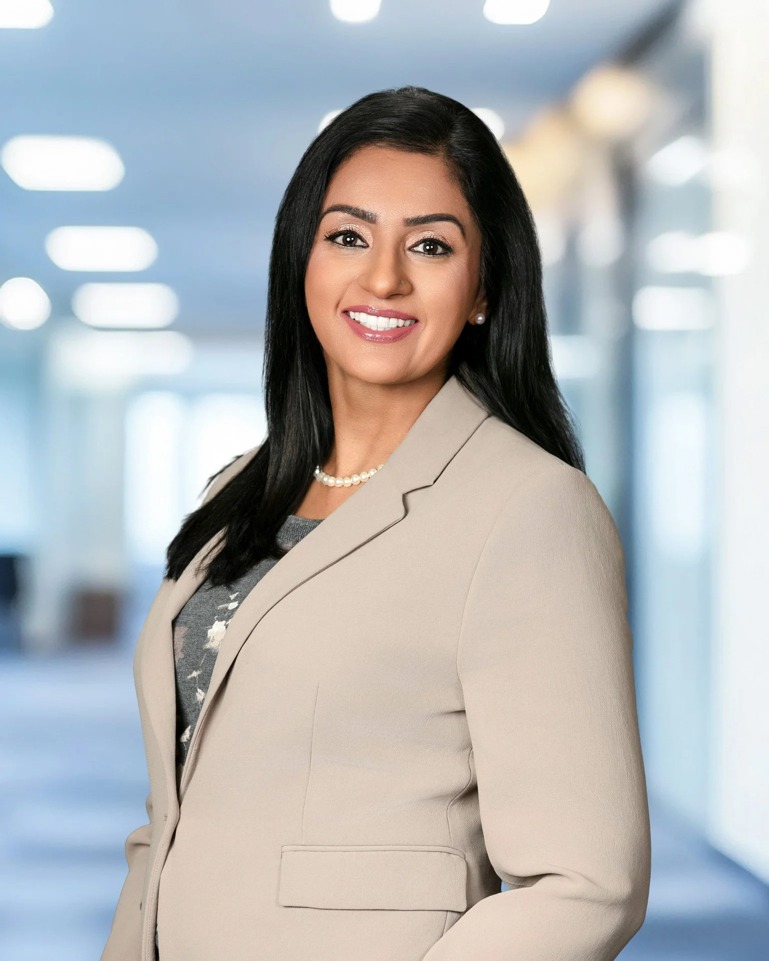 Working professional woman inside corporate office setting.