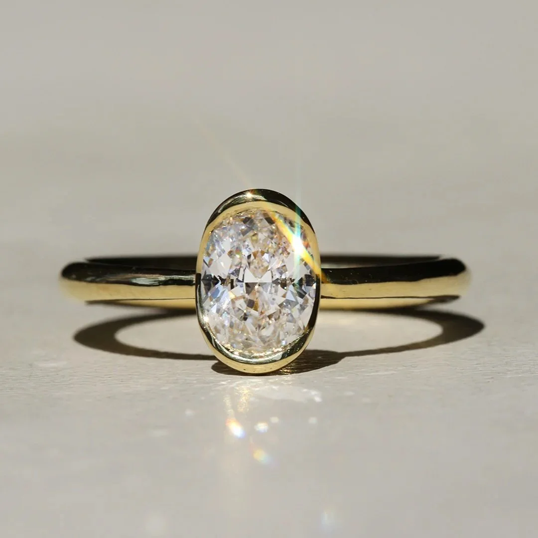 Oval Poppy Bezel Solitaire Ring