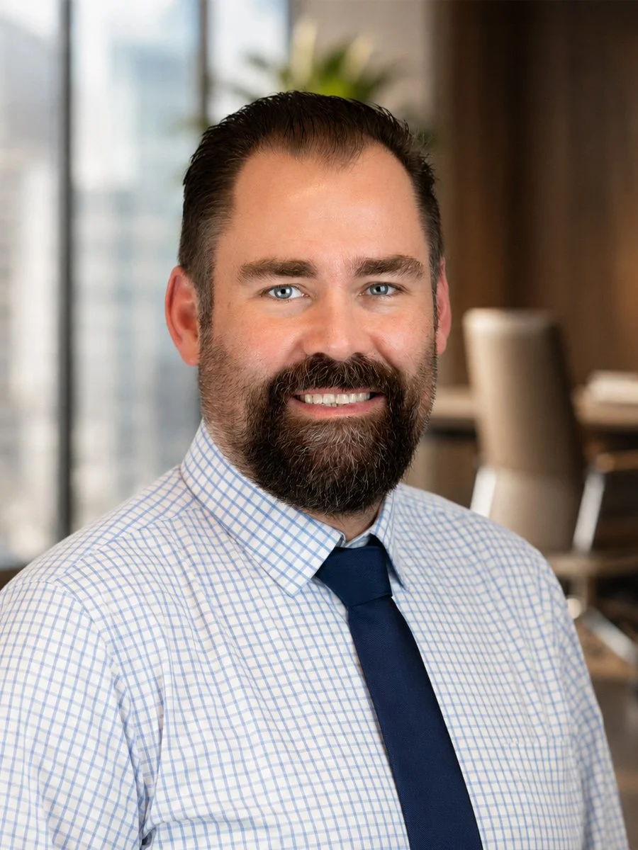 Headshot of a smiling man with a beard and blue eyes, John Winn owner and financial planner at Winn Financials & Tax Services in Redding, CA