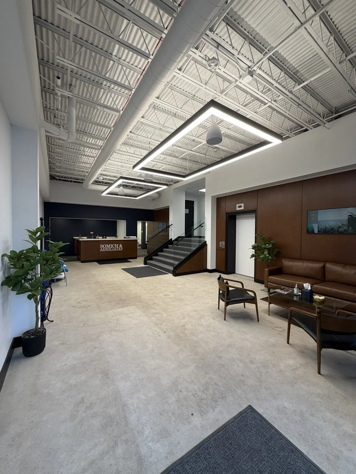 photo shows the main entrance of somich & associates looking towards the front desk