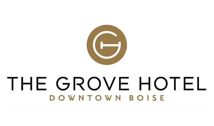 Logo of The Grove Hotel with a gold circular emblem and text indicating it's in downtown Boise.
