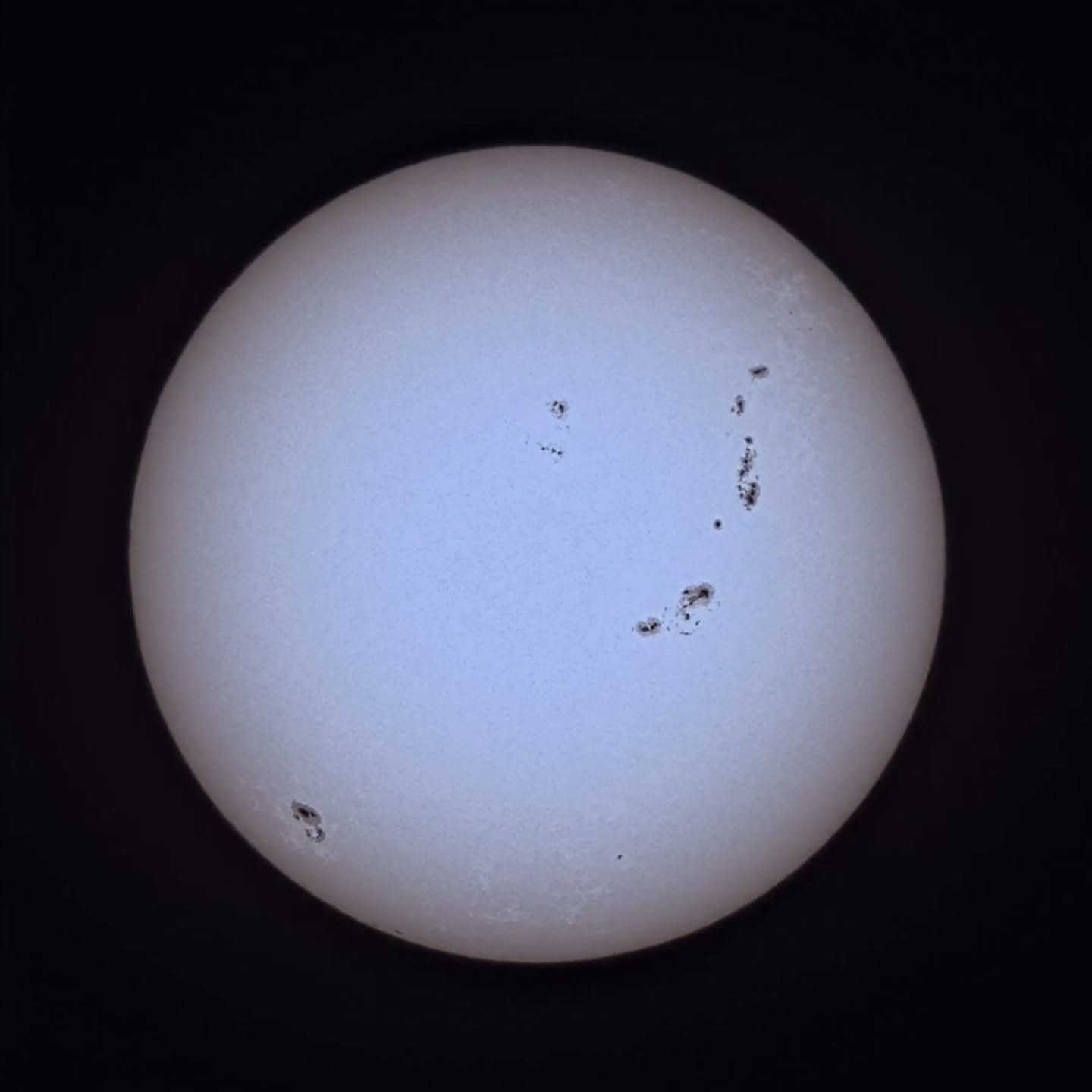 Sunspots from 10/23/24. I used my #seestars50 (with a Baader Planetarium filter for white light) to take a video. I ran it through Autostakkert!, Pipp &amp; Affinity Photo 2 to add texture &amp; a very slight orange tint, then had #Shutterfly print i