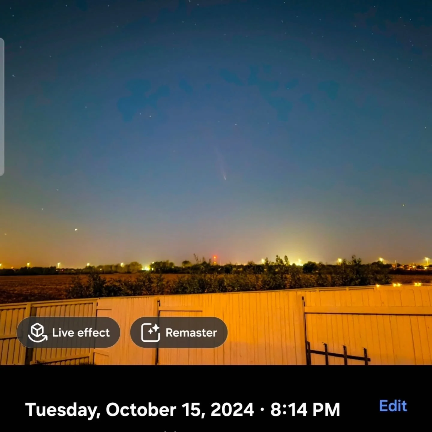 Taken with my cellphone! 
On October 15, 2024, at 8:00 PM, the comet C/2023 A3 (Tsuchinshan-ATLAS) was visible in the western sky shortly after sunset, having recently passed its closest approach to Earth. It was best viewed low on the horizon, appea