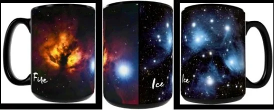 Three black ceramic mugs with galaxy and space-themed designs. The first mug features a fiery nebula labeled 'Fire.' The second mug displays icy blue stars and is labeled 'Ice.' The third mug shows a starry night sky with bright stars and also labeled 'Ice.'