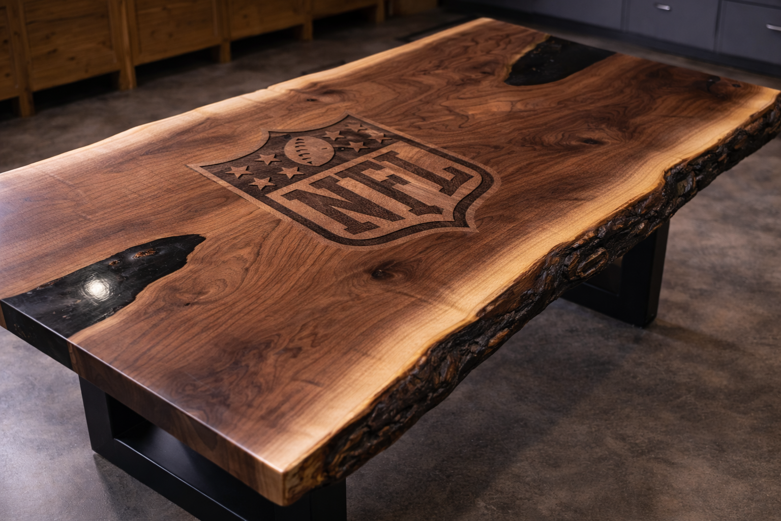 A wooden table with a polished surface, engraved with the NFL logo in the center, placed in a room with a concrete floor and wooden and metal furnishings.