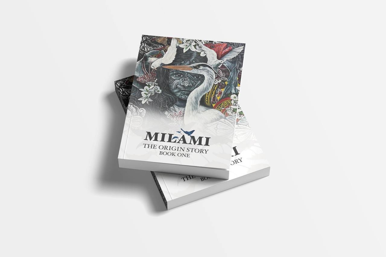 Two books titled "Milami: The Origin Story Book One" with illustrated cover art featuring a face, white cranes, and floral patterns, placed on a plain white surface.
