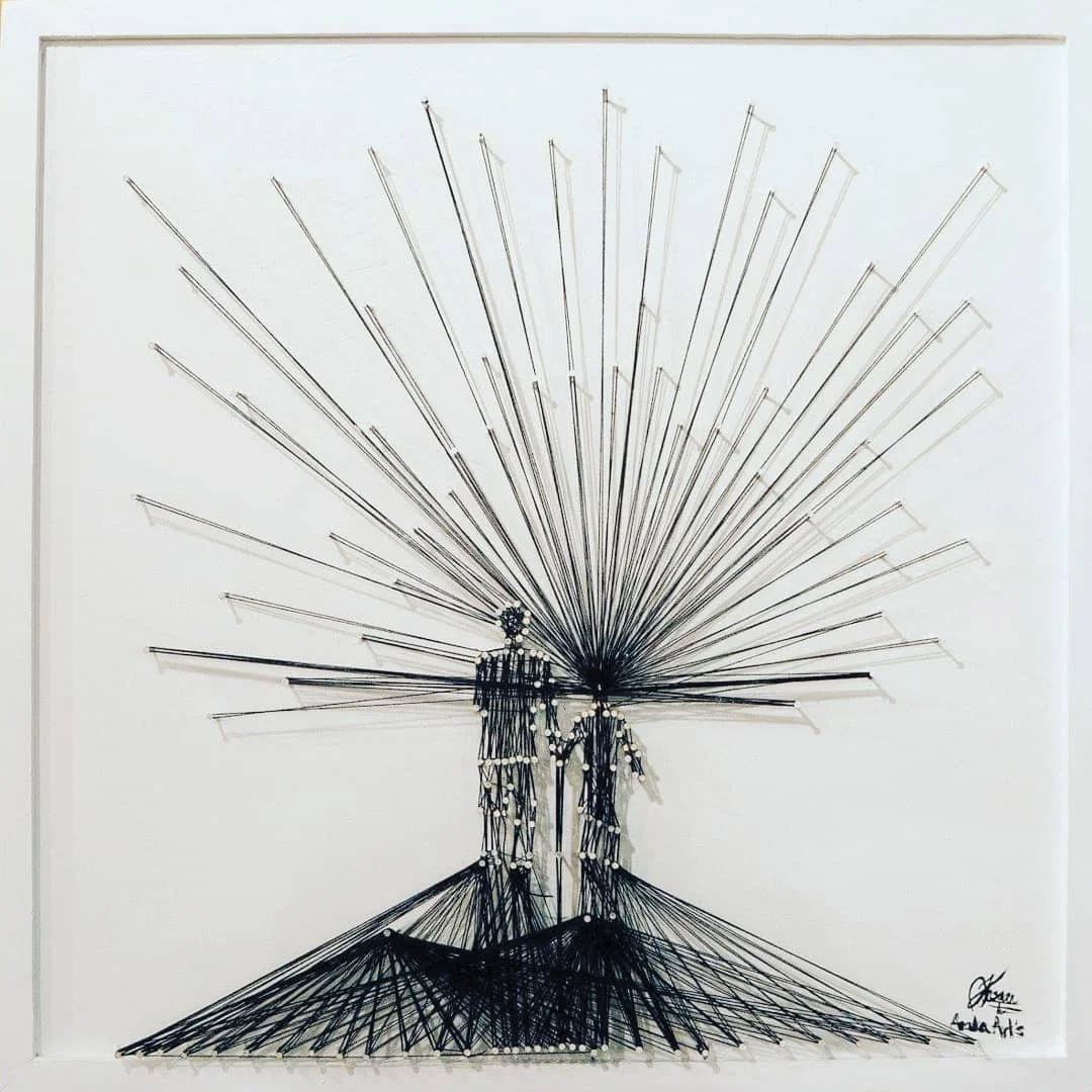 Minimalist wire sculpture of two figures standing under an expansive radial structure, with the artist's signature in the lower right corner.