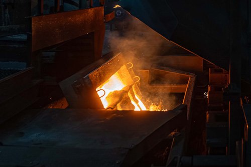 Bright molten metal during the aluminum casting process.