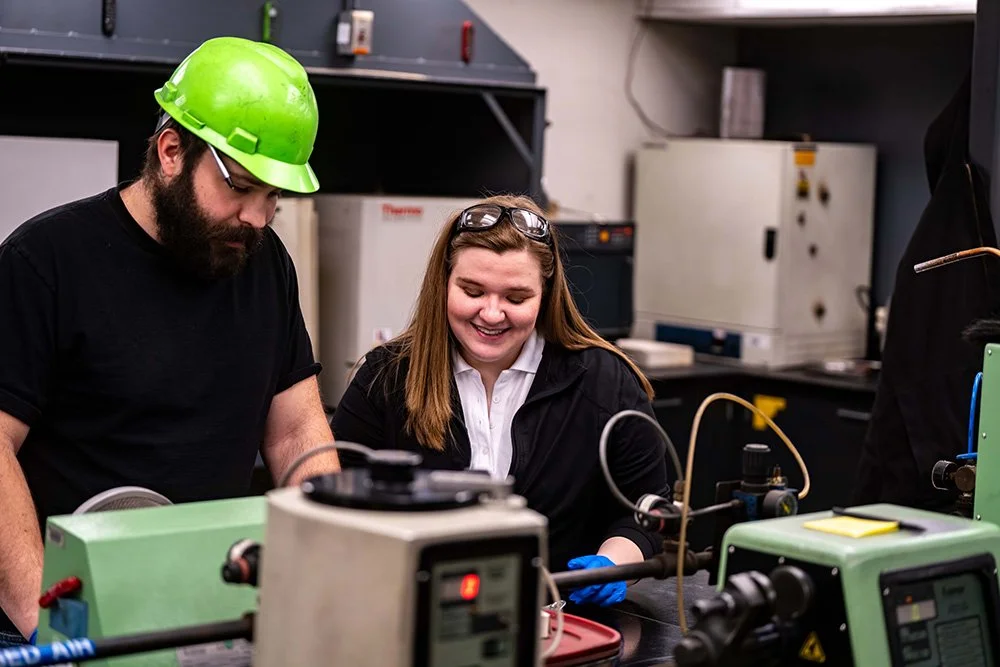 Manufacturing professionals working in a quality laboratory.