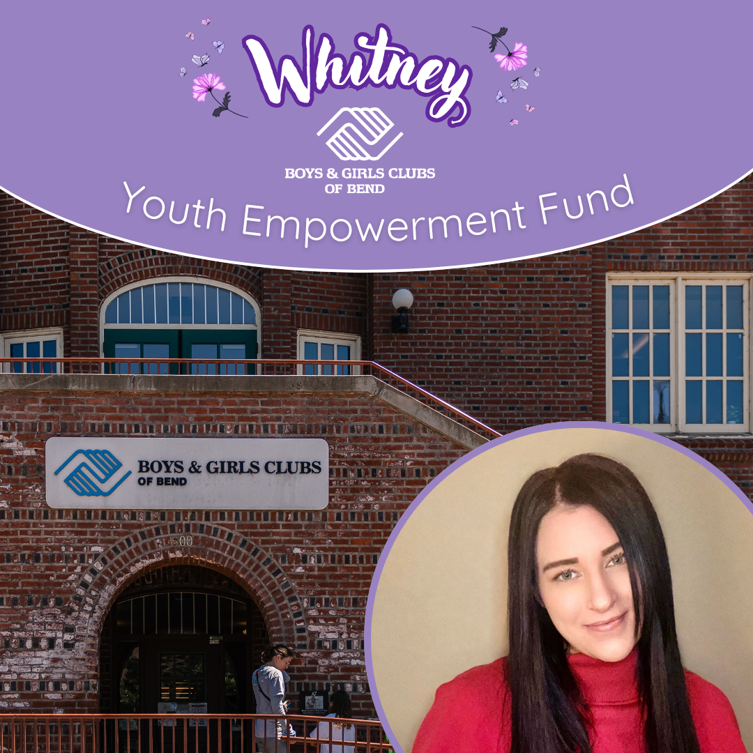 A woman with long dark hair and wearing a red top, smiling, with a background of a brick building and a large purple banner that reads 'Whitney Boys & Girls Clubs of Bend Youth Empowerment Fund', featuring a logo with two hands shaking.