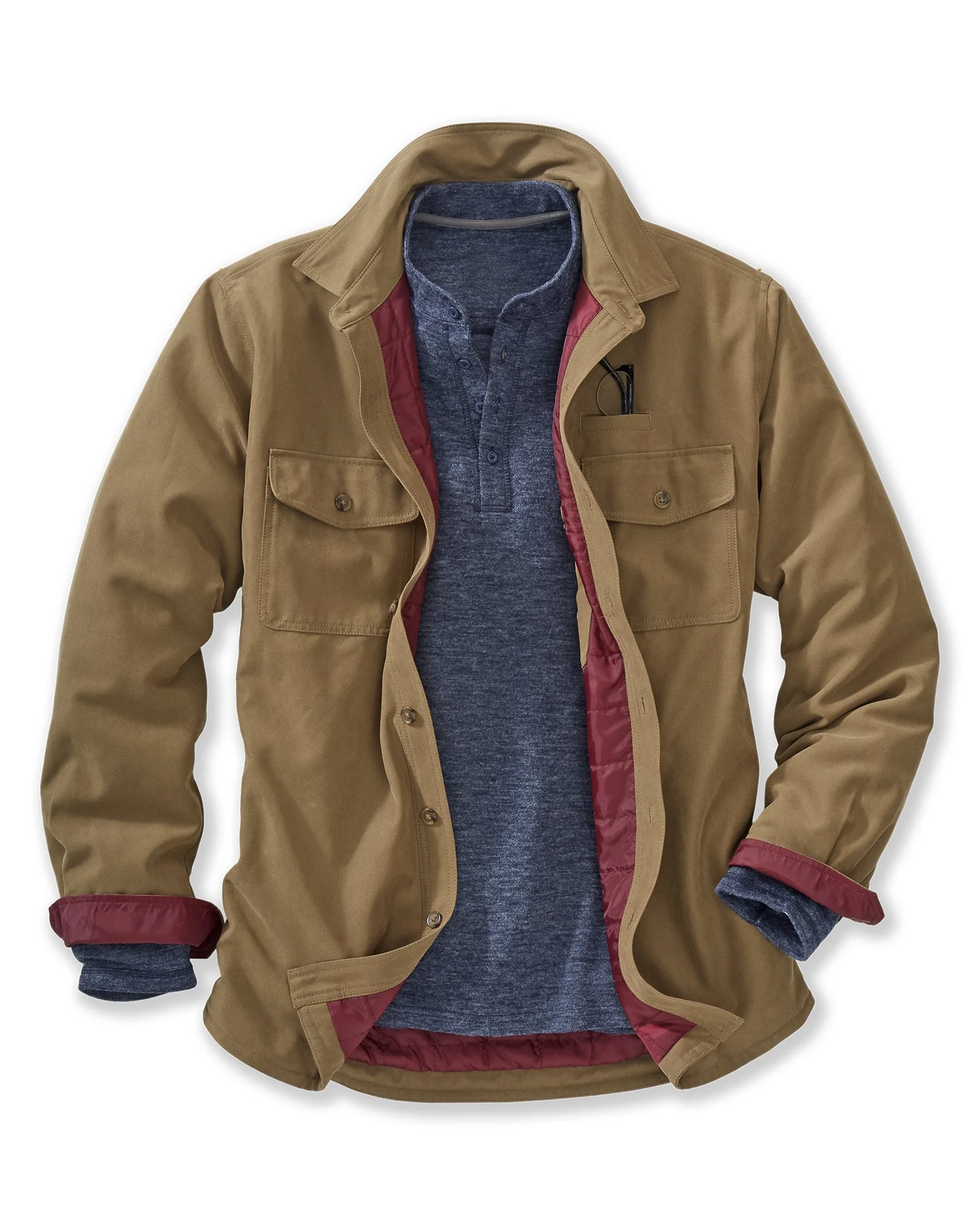 A style of men's fall and winter outfit featuring a tan jacket over a blue henley shirt, with the jacket's tan outer shell and red and blue inner lining visible. The jacket has chest pockets and rolled-up sleeves.