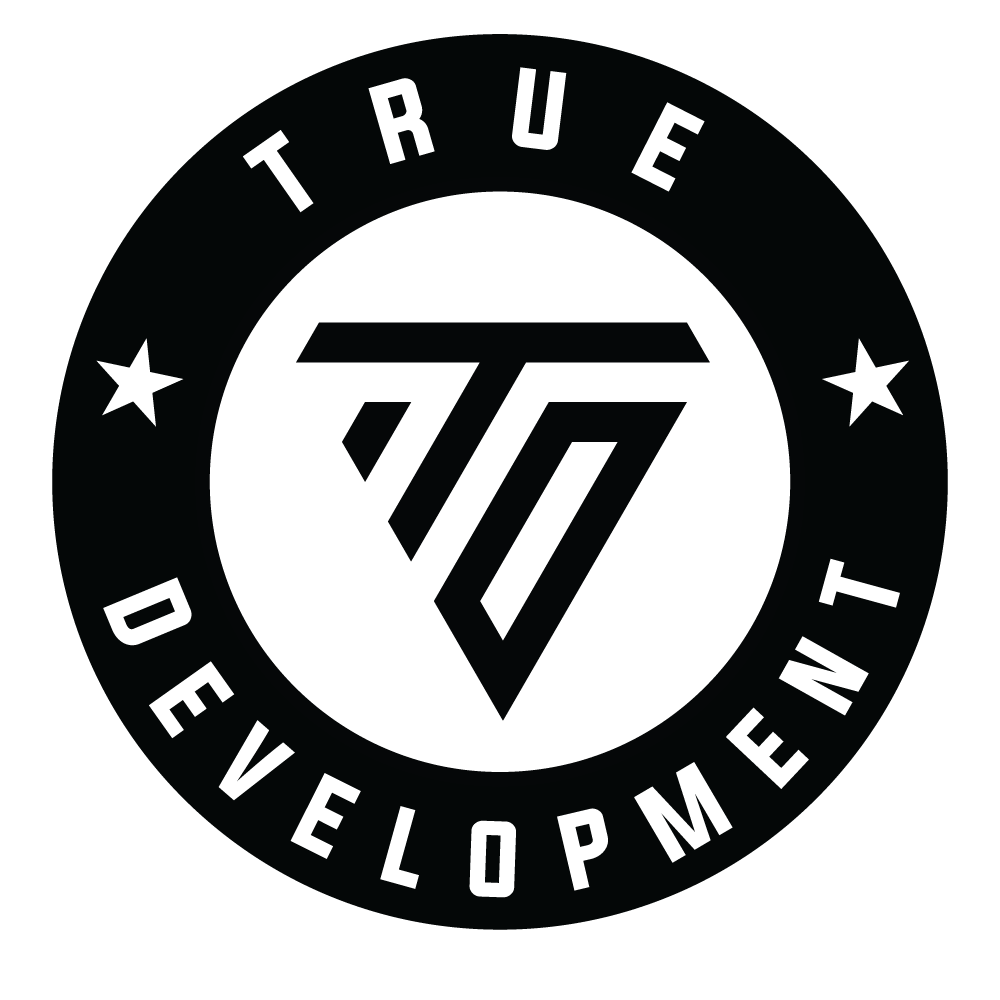 Black and white circular logo with the words 'TRUE DEVELOPMENT' around the perimeter and a stylized 'T' and 'D' in the center.