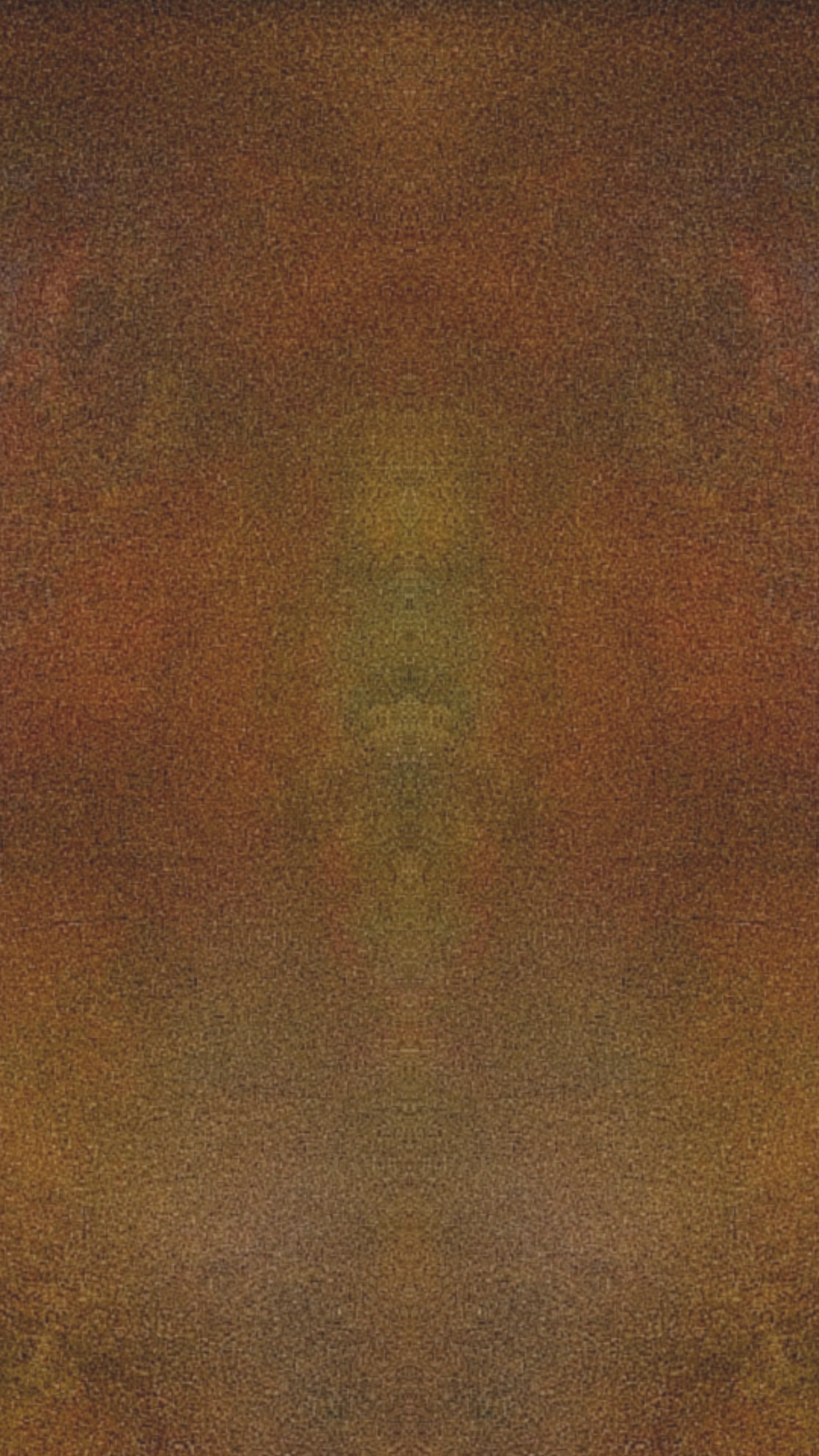 Blurred abstract image with brown and yellow tones.