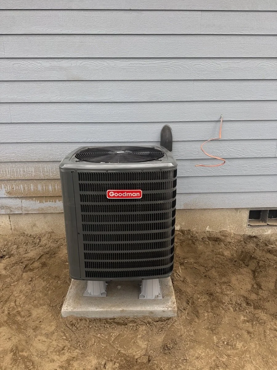 oodman residential HVAC condenser unit installed outside a home in the Tri-Cities by 7BlueSky Heating & Air