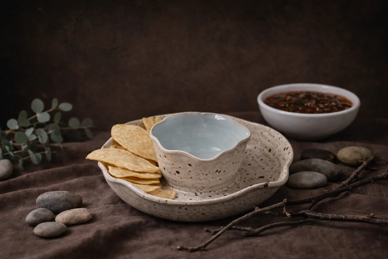 Ceramic pistachio dish with dipping sauce and chips