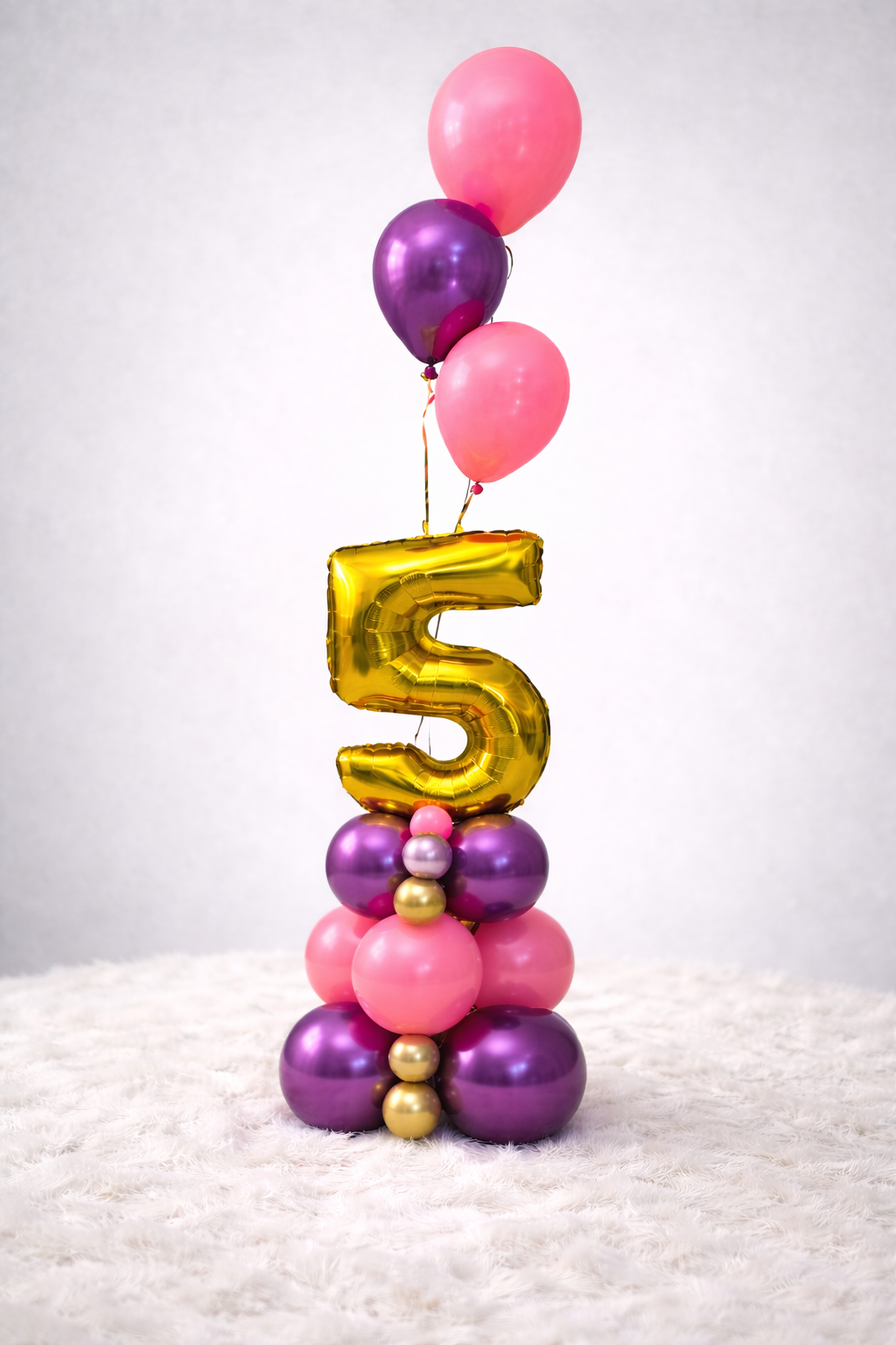 Personalized balloon number stacks for birthdays, anniversaries, graduations, and milestone celebrations throughout Nassau, Bahamas.
