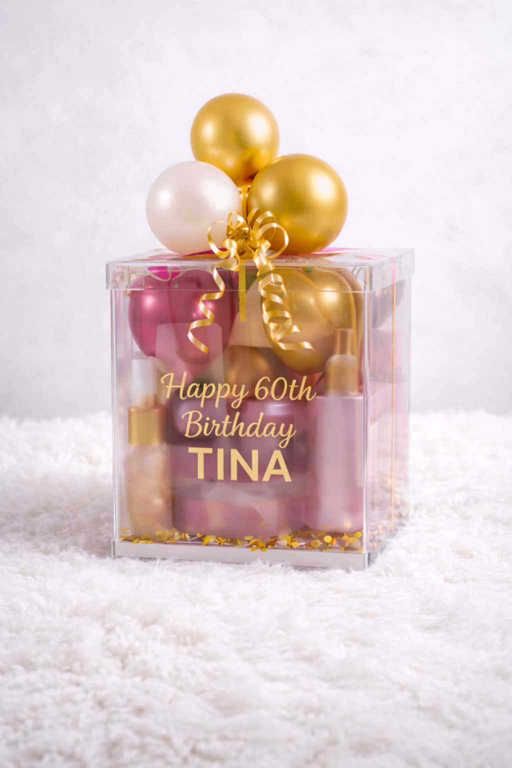 Personalized birthday balloon gift box with gold balloons and custom acrylic box by Balloon Bar Bahamas in Nassau, Bahamas.