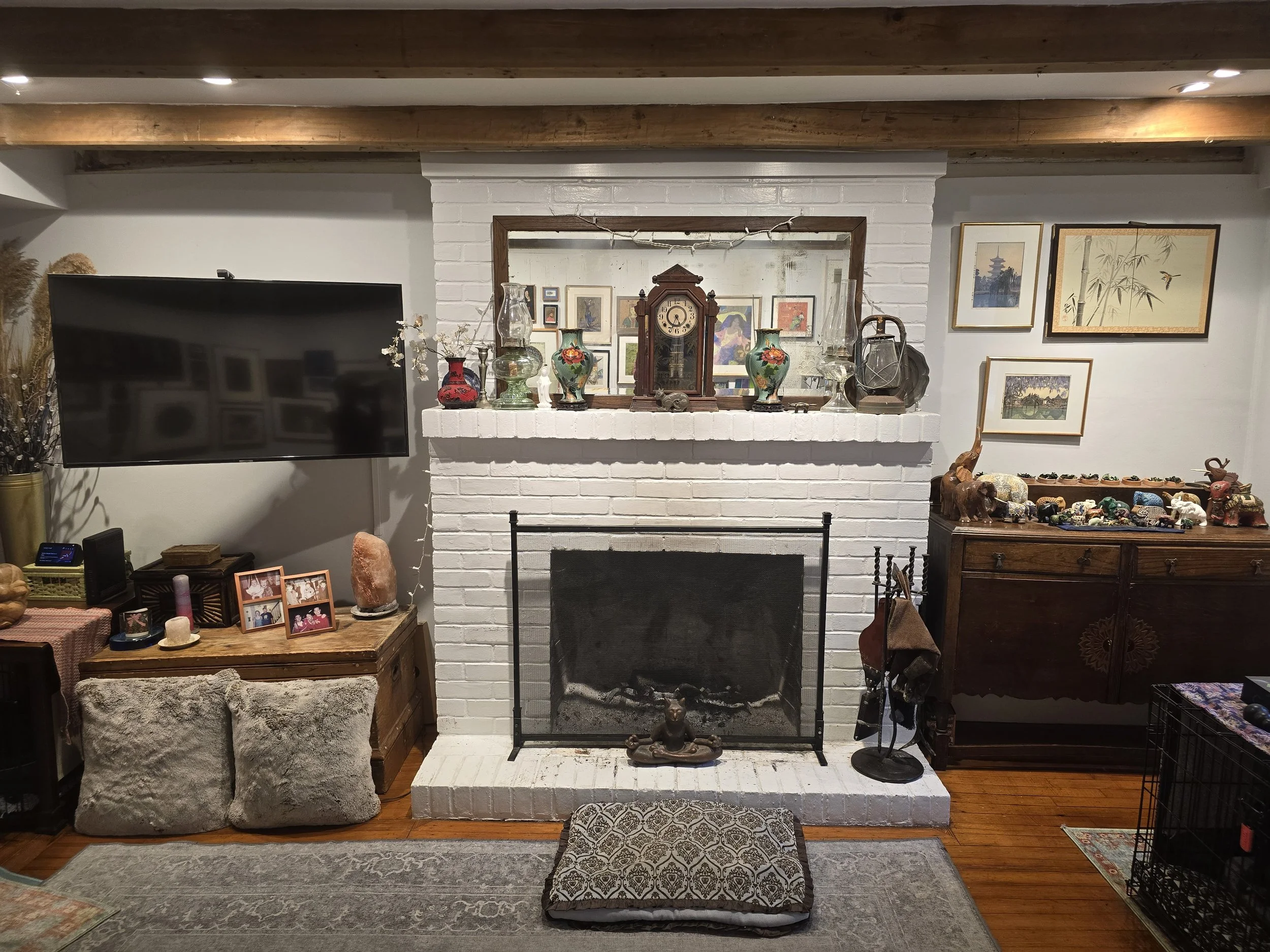 Fireplace in original beamed room of 1776 sandstone house, the Little Dog Retreat, Hudson Valley NY