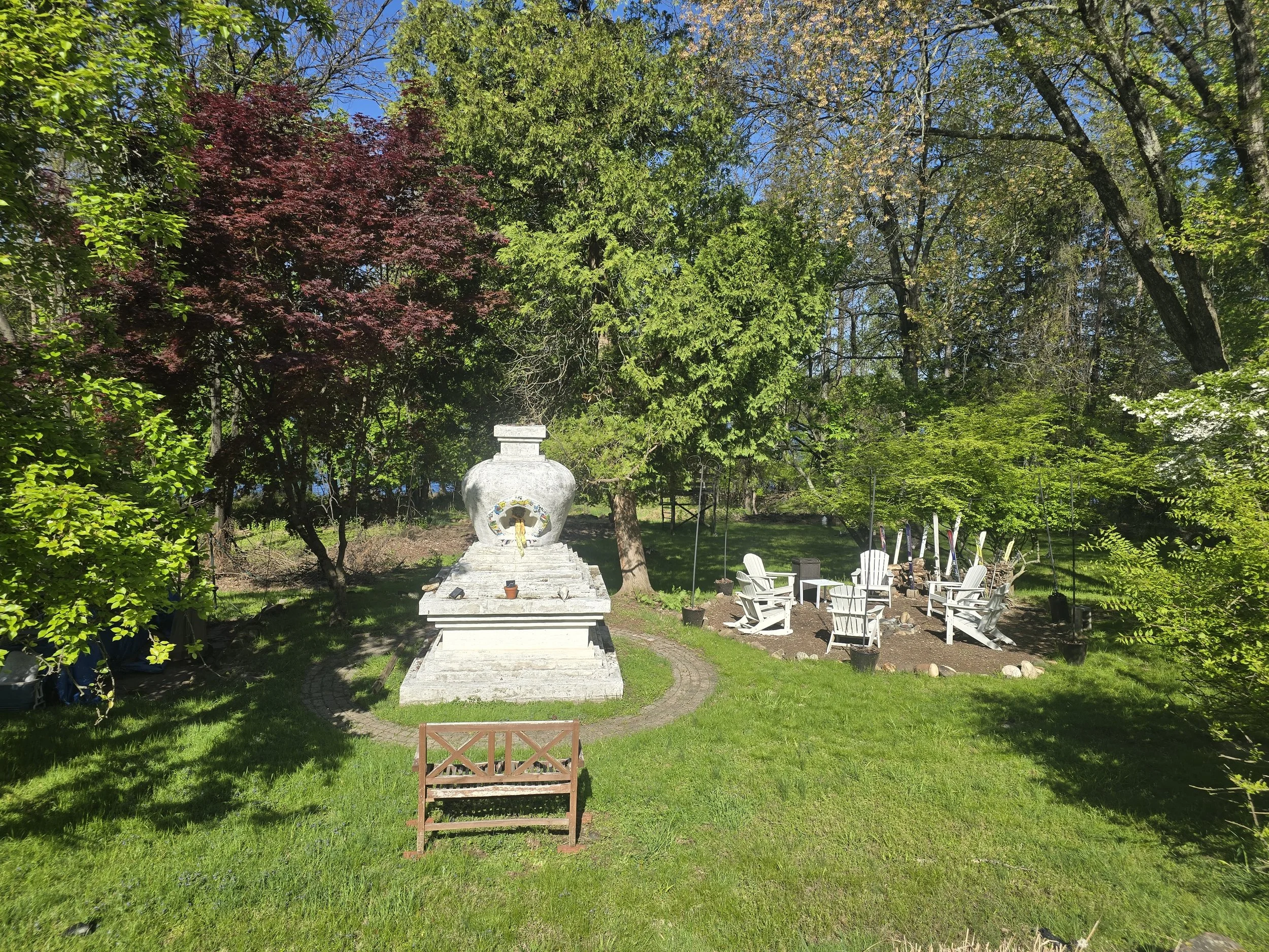 Buddhist stupa and firepit on the grounds of The Little Dog Retreat, Hudson Valley, Upstate NY