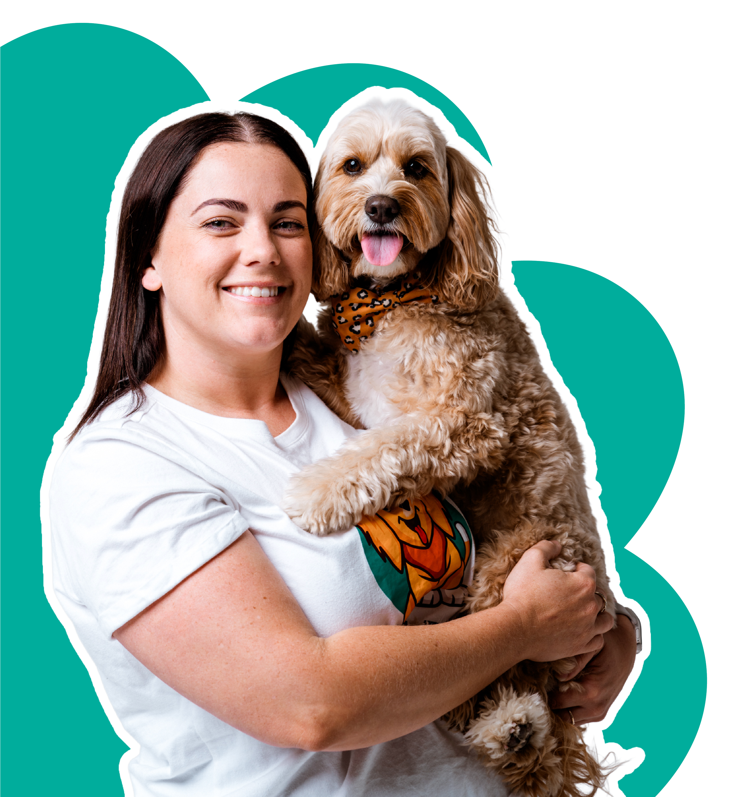 Smiling woman holding a fluffy dog with a bandana around its neck, against a teal background.