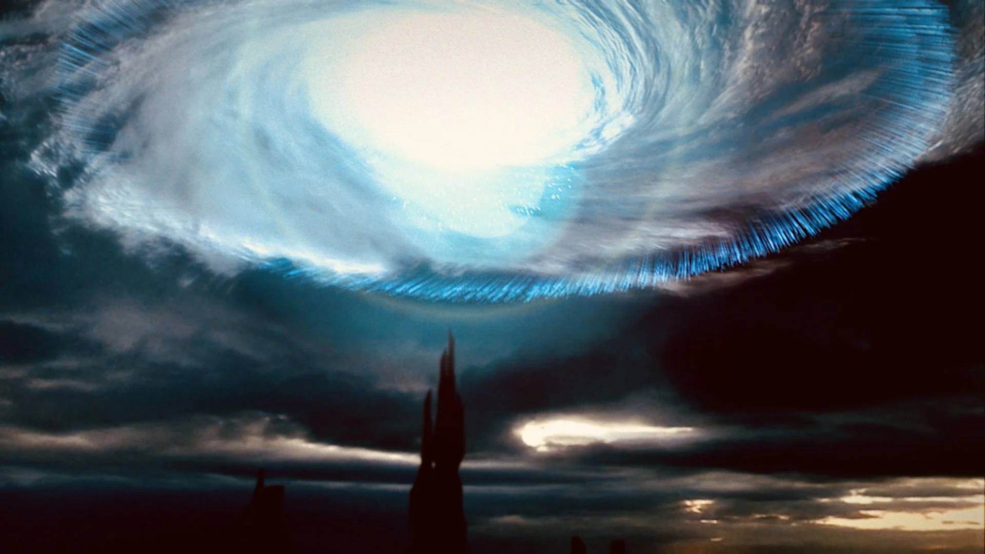 An atmospheric scene showing a dark sky with swirling clouds and a large, glowing, swirling vortex or portal in the sky that appears to emit blue and white light.