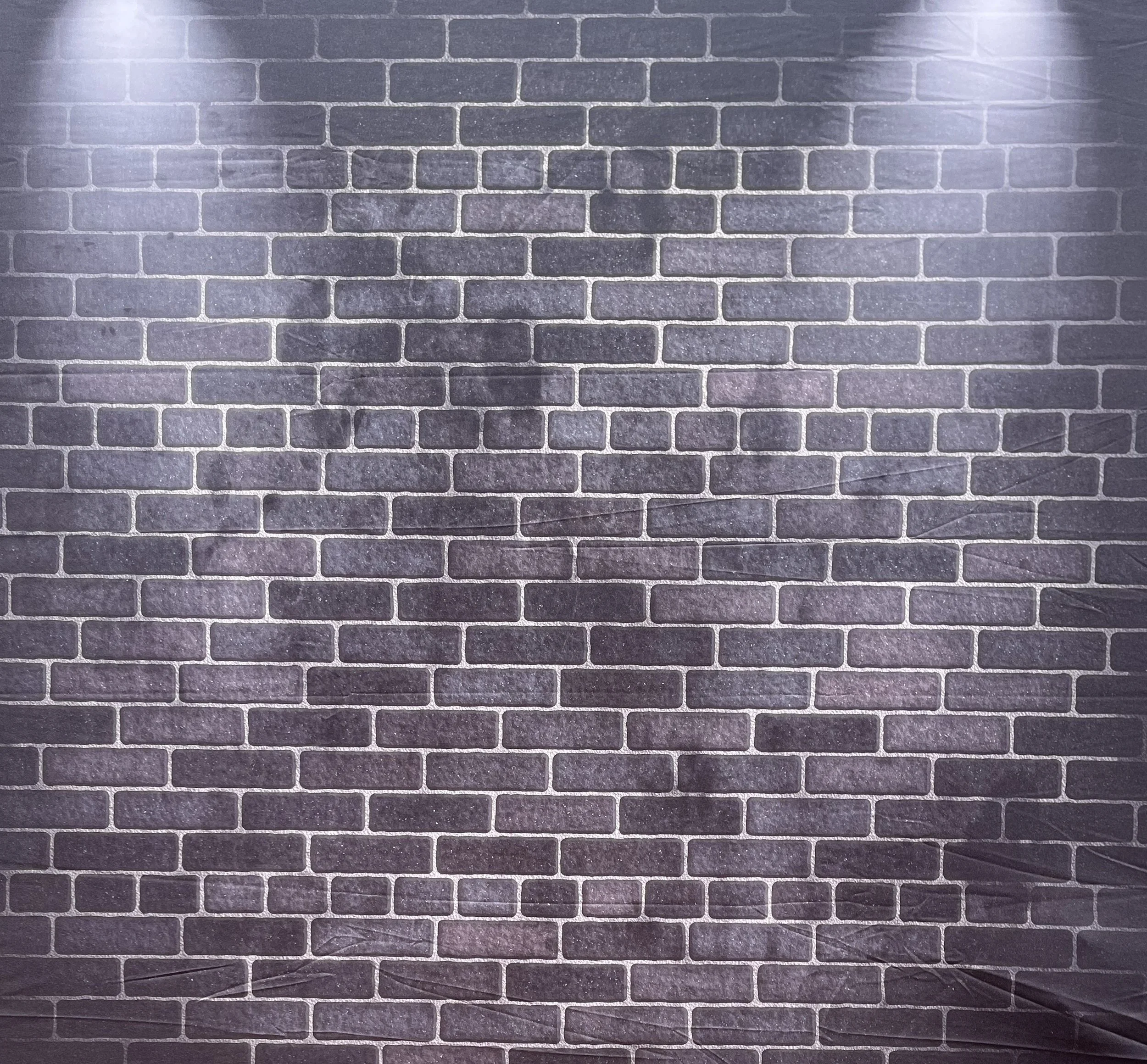 Dark gray brick wall photobooth backdrop
