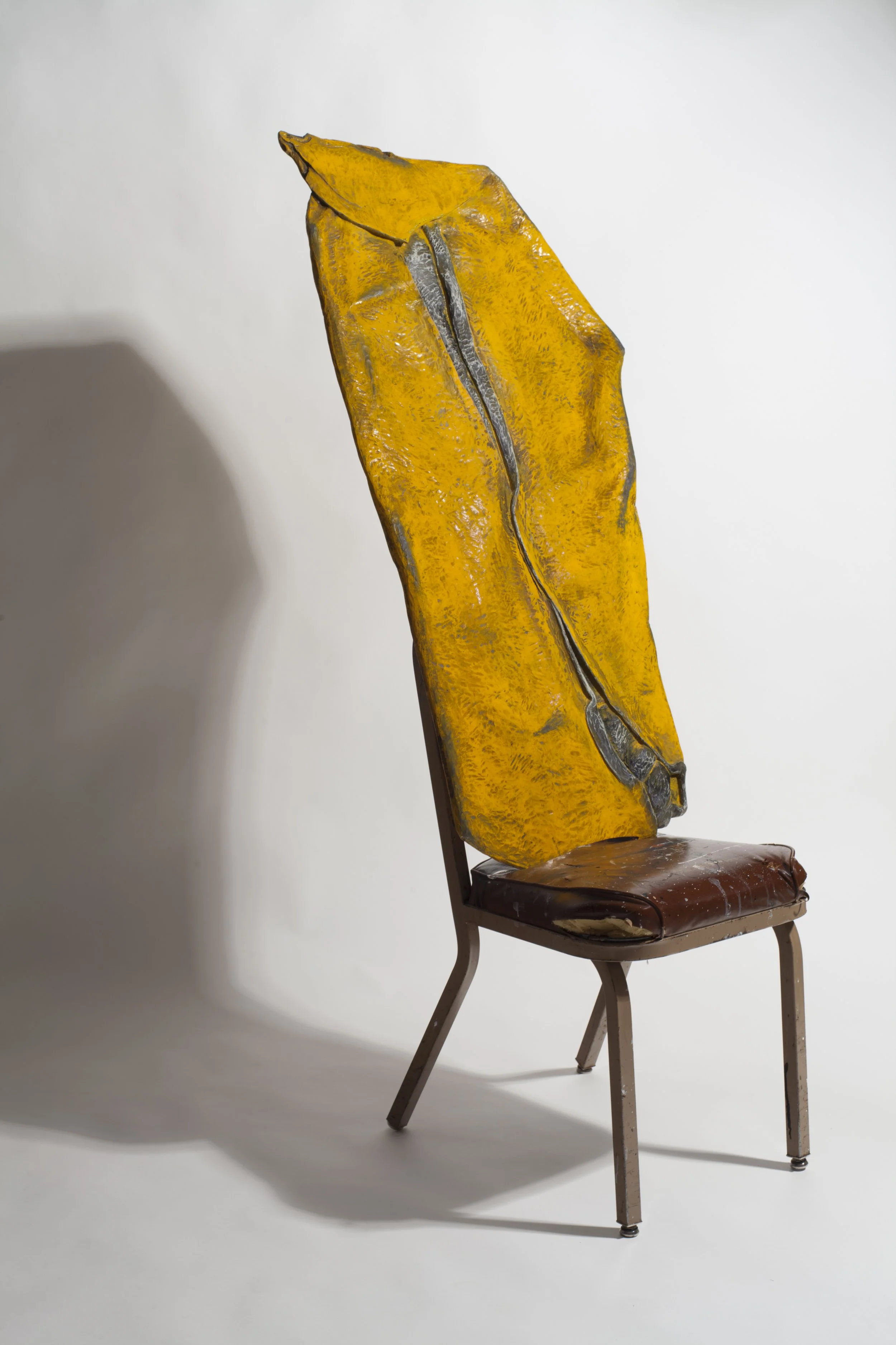 Yellow Smash Up, carved and painted wood on chair, 47 x 24 x 5 in., 2013