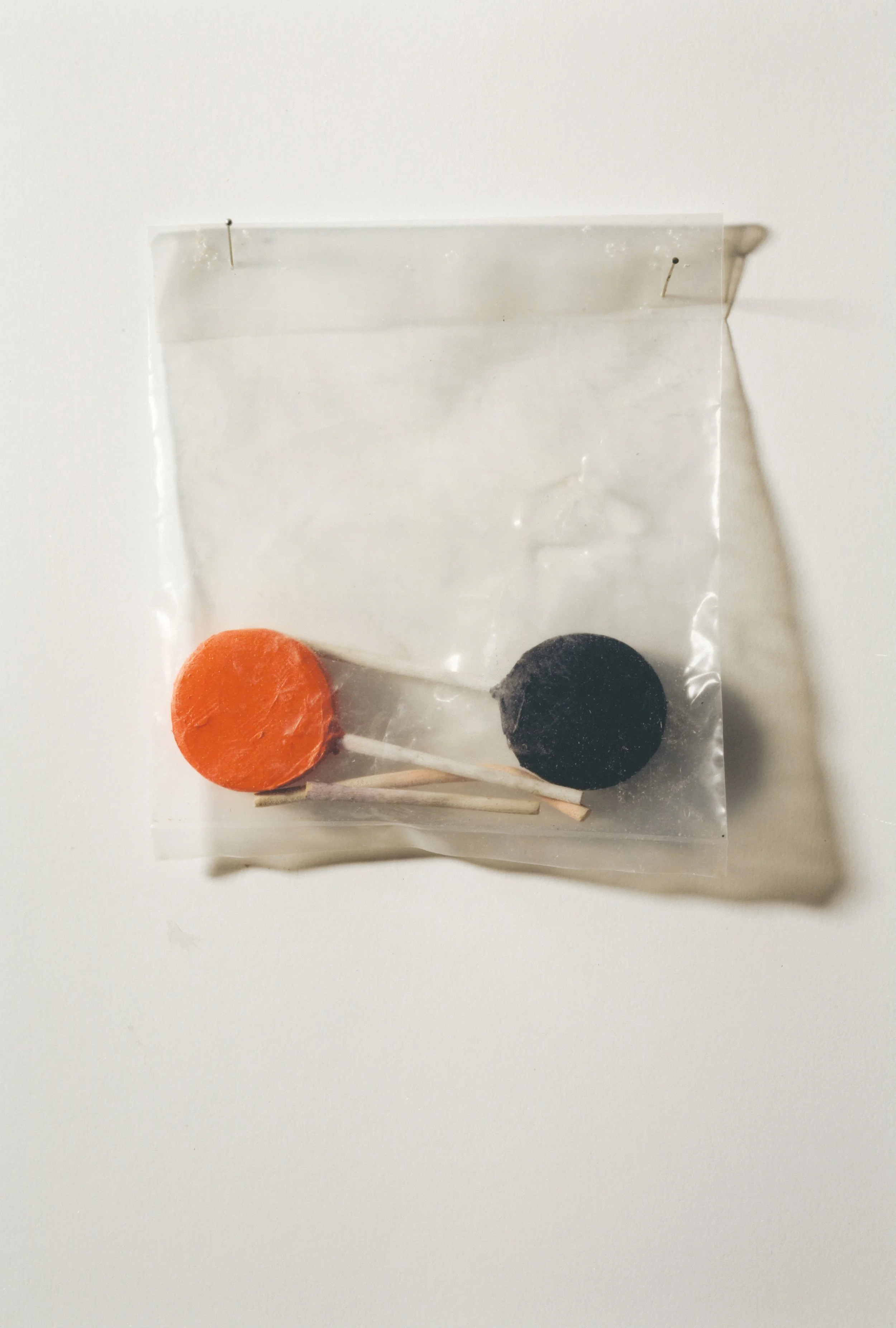 Pops, carved and painted wood with plastic bag, 2002
