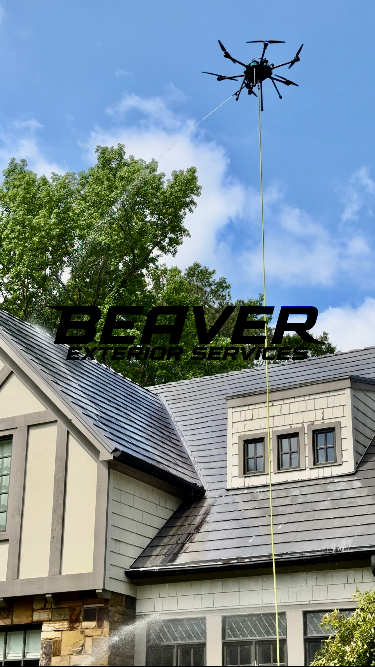 Drone spraying water on a house roof with trees and a blue sky in the background. Overlaid text says 'Beaver Exterior Services'.