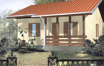 A small house with beige walls, a red-tiled roof, and wooden shutters on the windows, with a porch and a garden.
