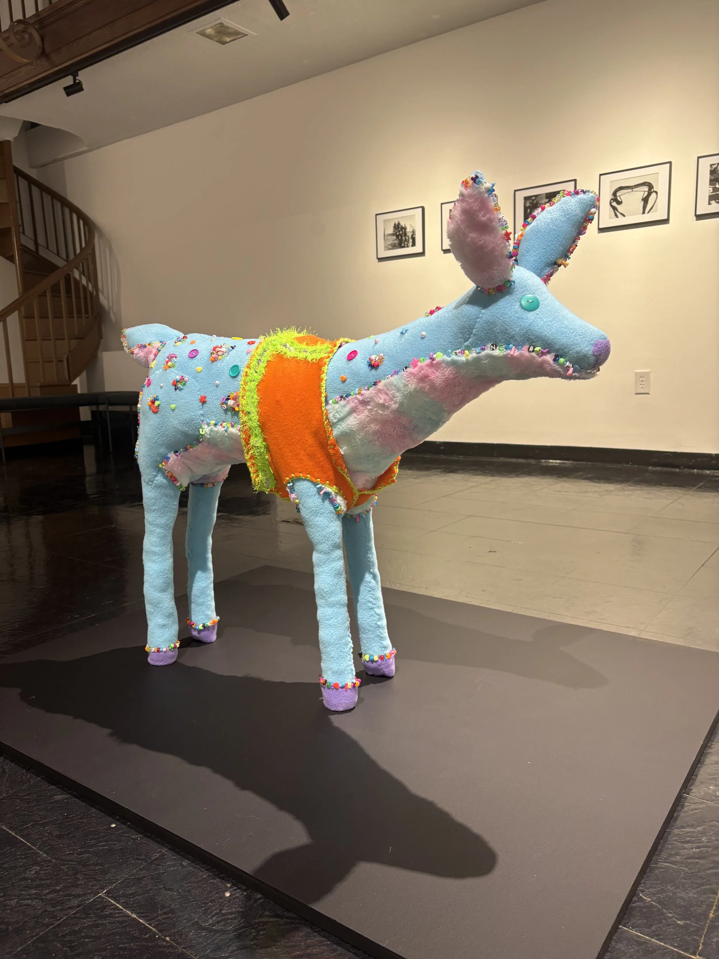 Vest (To Keep Her Safe) (installation), 2026. Wire frame deer, memory foam, fleece, faux fur, buttons, beads, embroidery thread, (31in x 10in x 41in)
