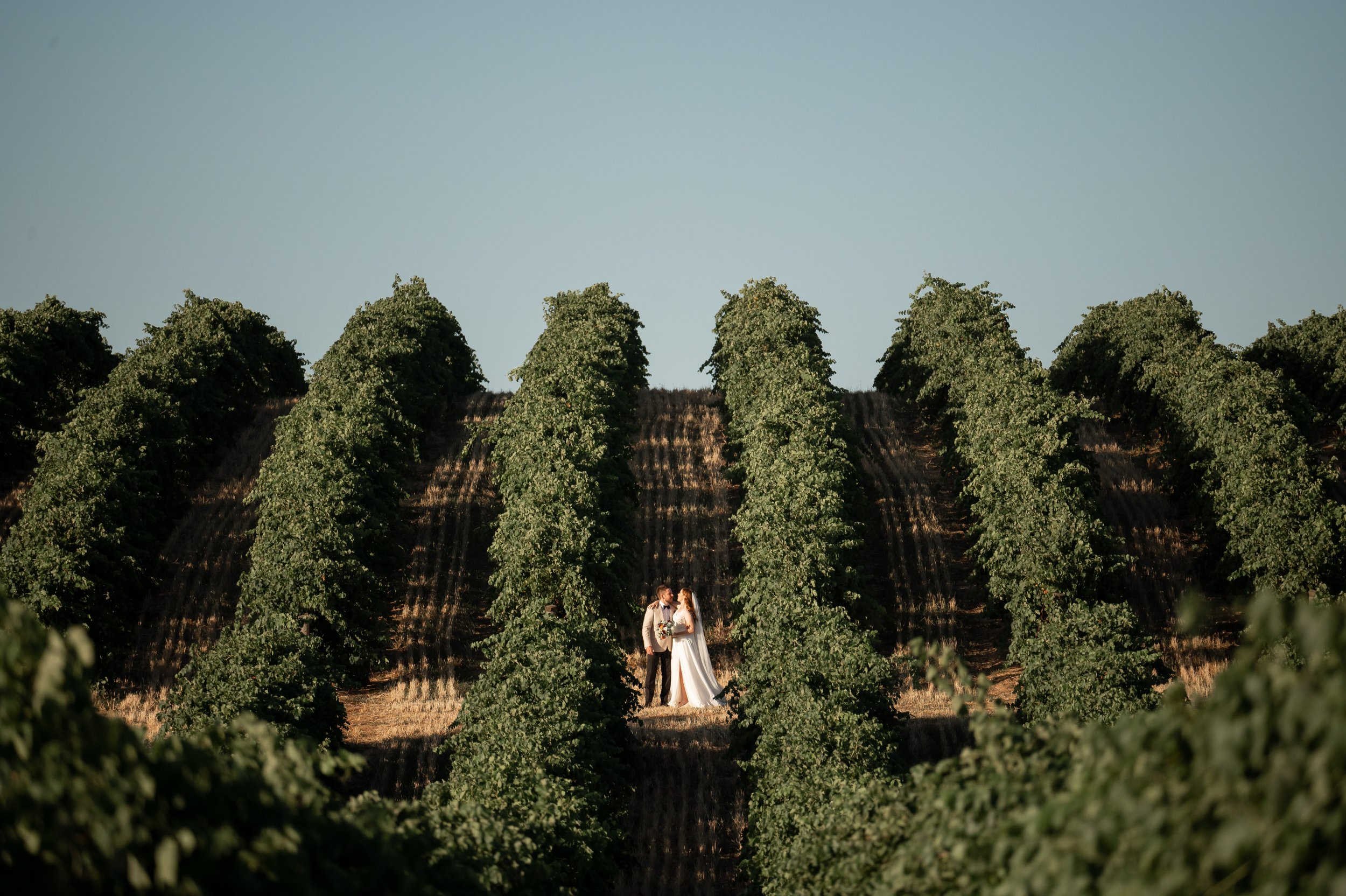 Laurie’s customers, Evan and Kade, running down a mountain after getting married. 