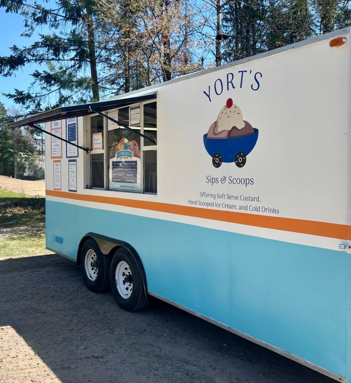 Mobile ice cream vendor trailer in Northern Wisconsin offering soft serve custard and ice cream
