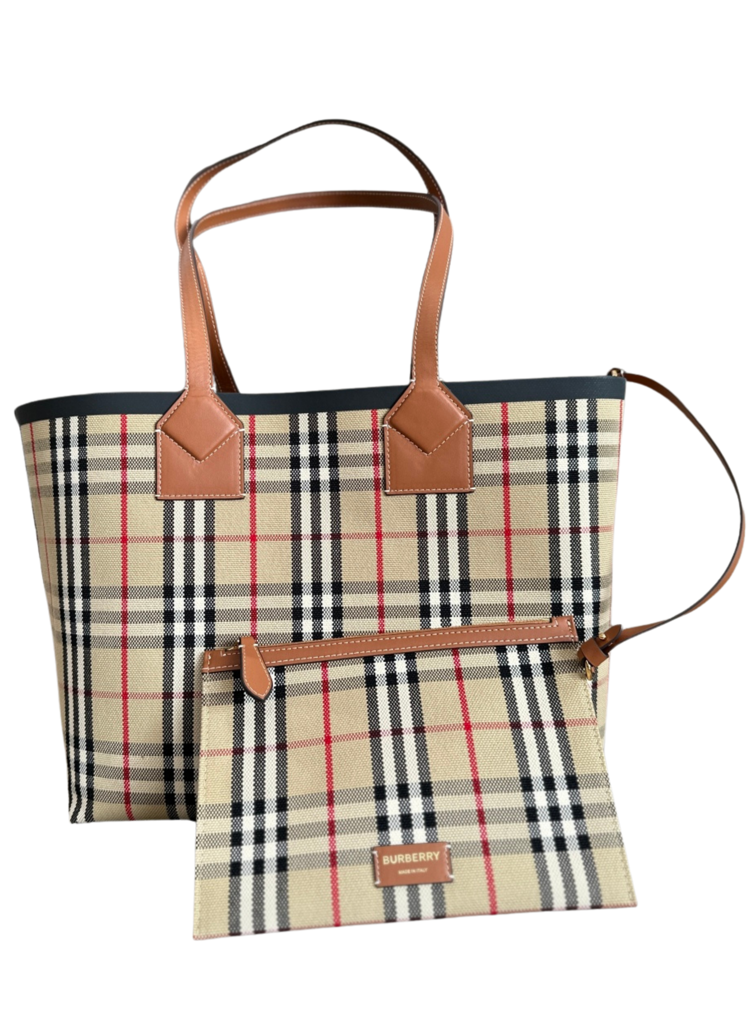 A Burberry tote bag with a classic check pattern featuring beige, black, red, and white, with brown leather handles and accents, accompanied by a matching zippered pouch.