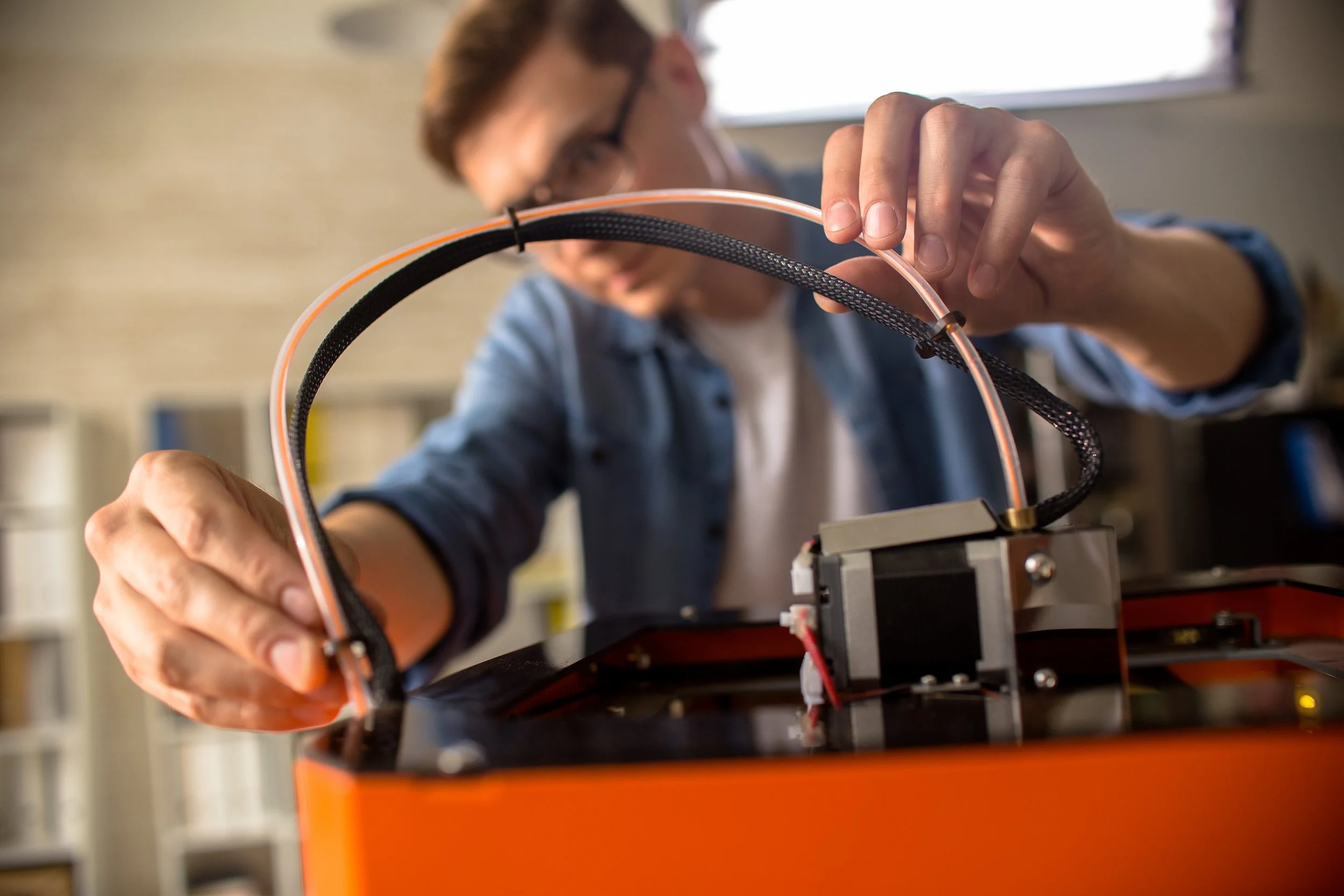 man-working-on-3d-printer-in-workplace-2026-03-19-23-02-04-utc.JPG