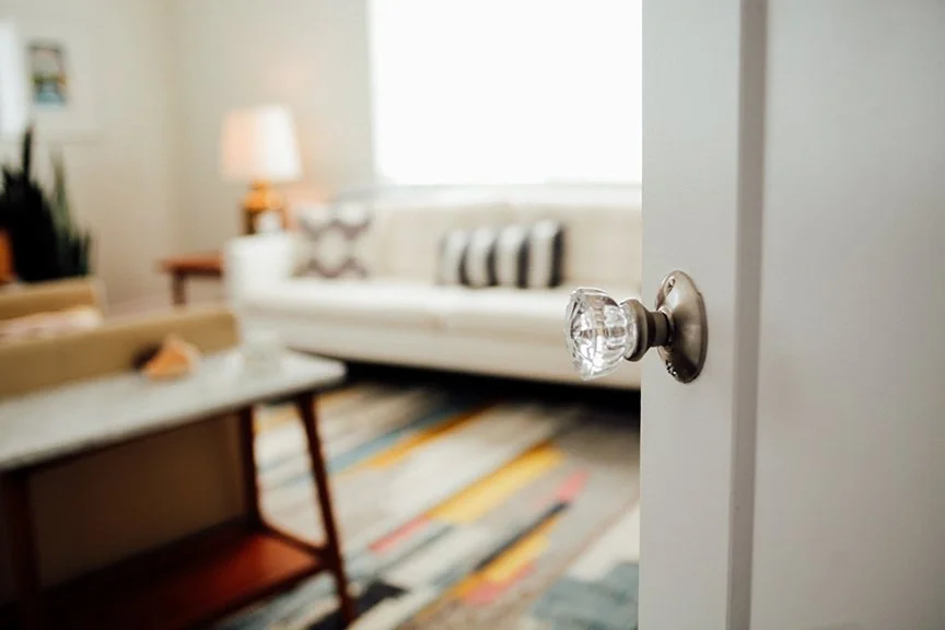 A crystal door knob on an open door revealing a warm therapy office interior — Jenny Walters Psychotherapy, Highland Park, Los Angeles