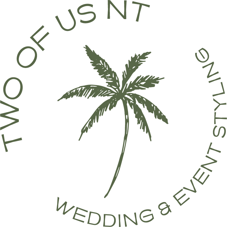 A palm tree illustration with circular text around it reading "Two of us N T Wedding & Event Styling."