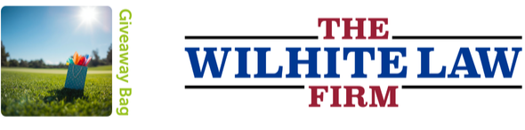Logo for The Wilhite Law Firm, with a graphic of a blue bag filled with red and yellow fruits, set against a sunny outdoor background, and the words 'Giveaway Bag' in green on the left side.