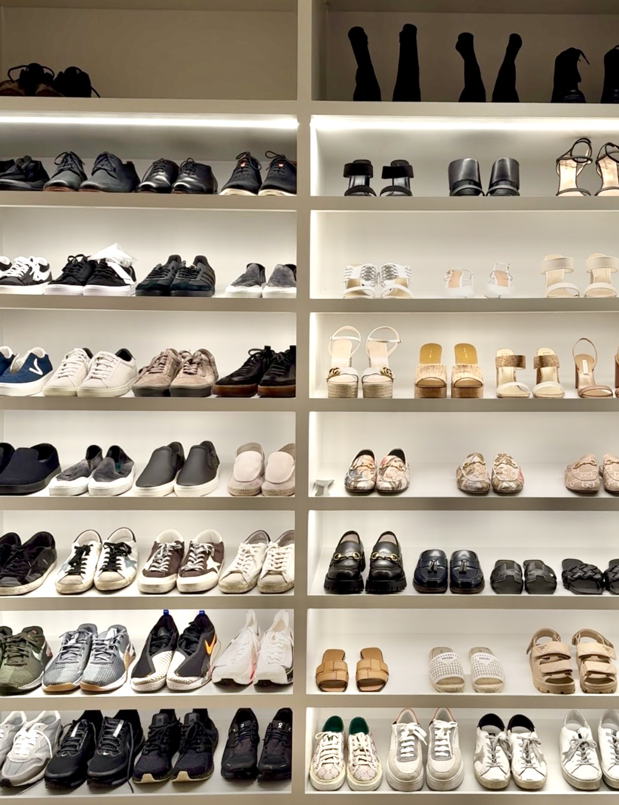 Professionally organized shoe shelves and closet with categorized sneakers, heels, sandals, and boots — home organization services by Ordered Living Co. Austin TX